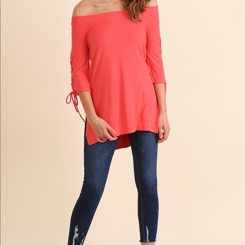 NWT off shoulder shirt with lace up sleeve details. Runs roomy. Coral color